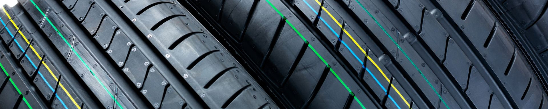 Image displaying a variety of new tires available at Holm’s Mechanical LTD., showcasing our selection and expertise in tire sales and installation services.
